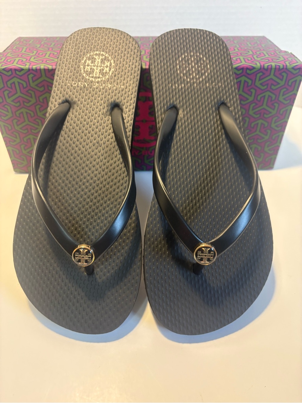 Tory Burch Black Flip Flops with Gold Logo Medallion discontinued